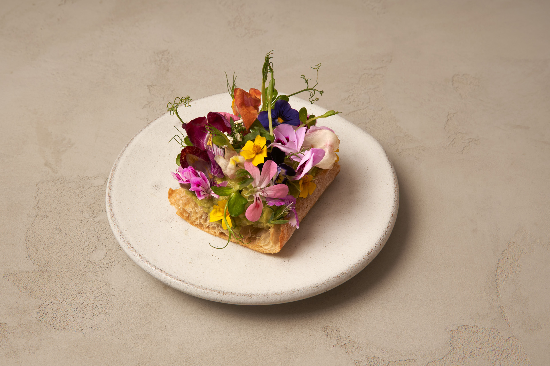 Avocado toast adorned with edible flowers
