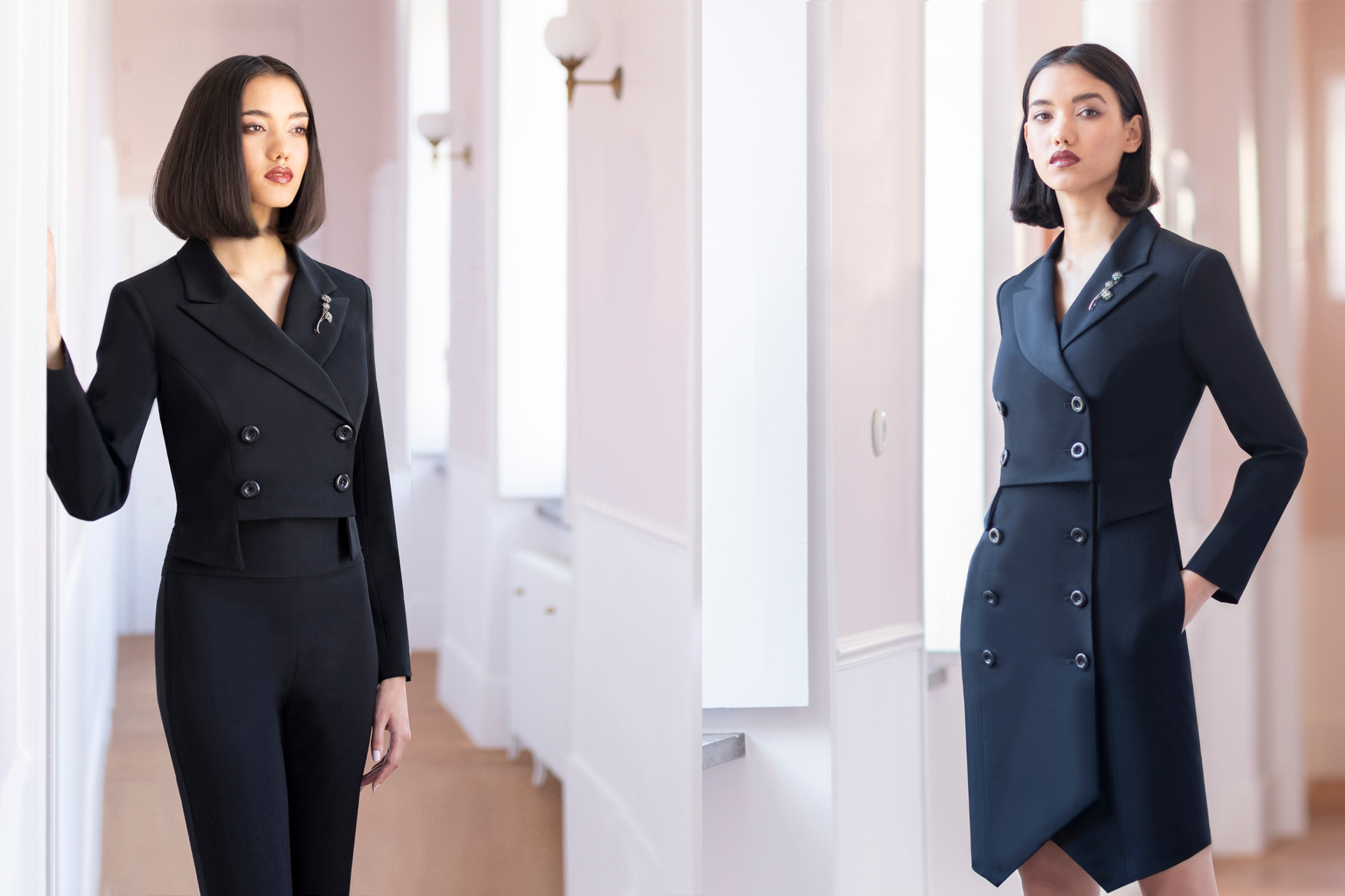 Tow models on different ends of a neautral coloured hallway wearing dark clothes