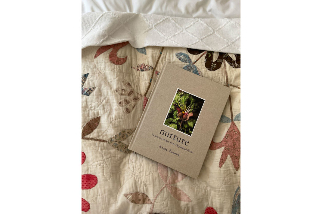 Carole Bamford's book, Nurture, features at The Den suite on a bed at The Fox at Oddington in the Cotswolds, UK