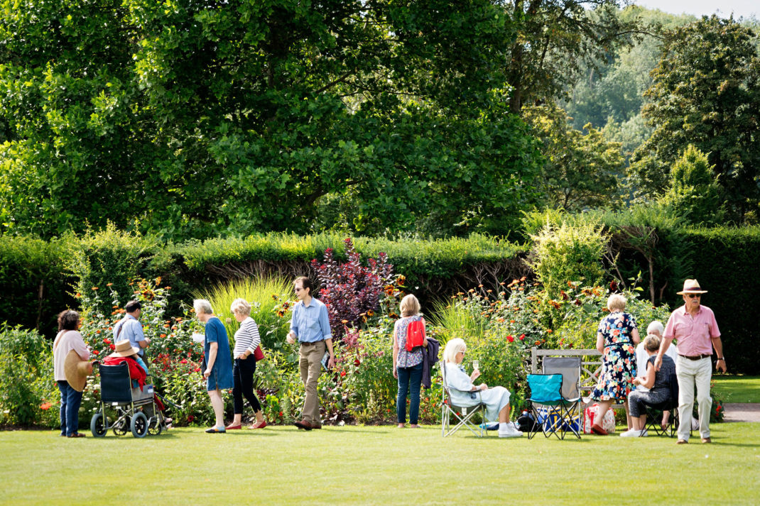 people enjoy the gardens at Glyndebourne, photography: James Bellorini