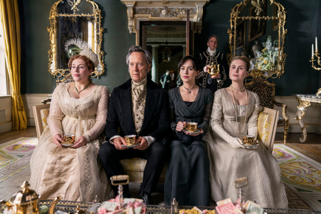 Netflix's film, Persuasion, where the characters sit down on a chair with grand mirrors in the background