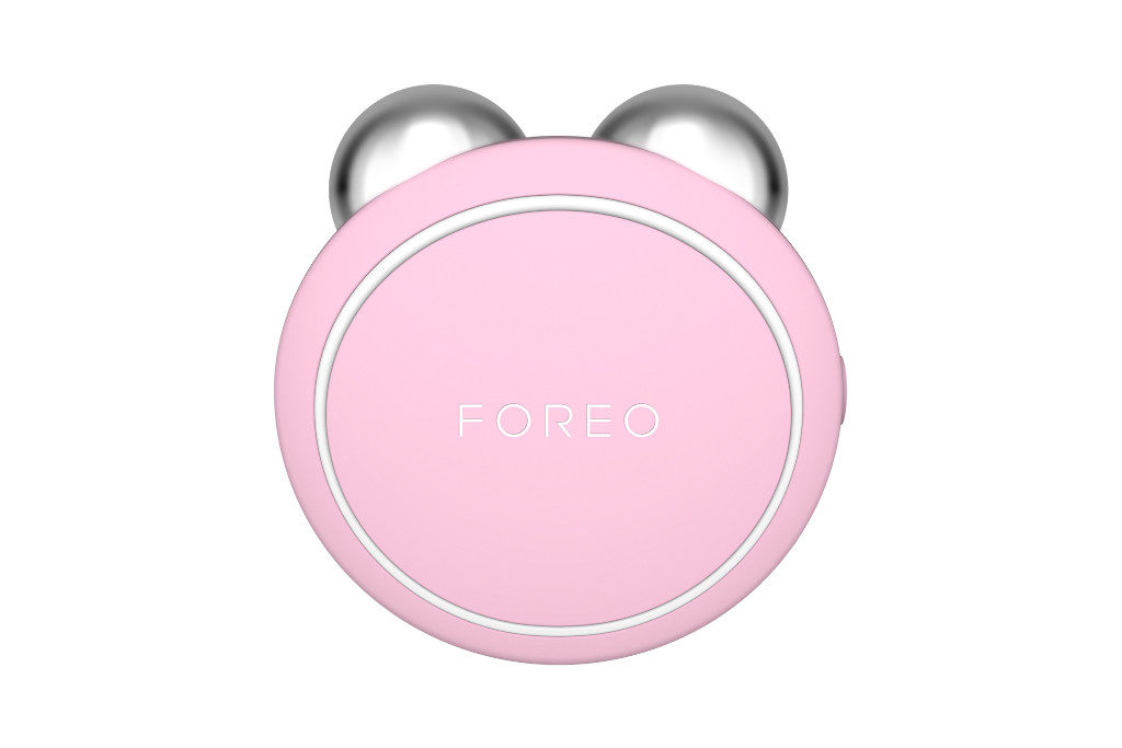 Pink circular tool with silver balls at the top