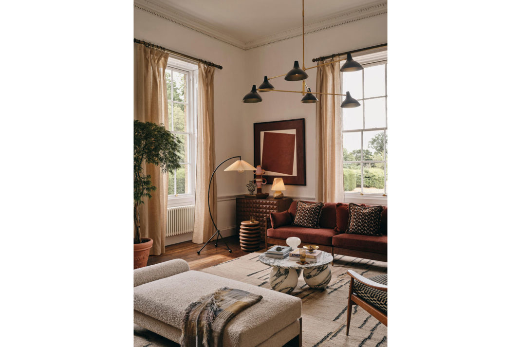 a living room with Soho Home's new chandelier: the Olivier Mid Century Chandelier