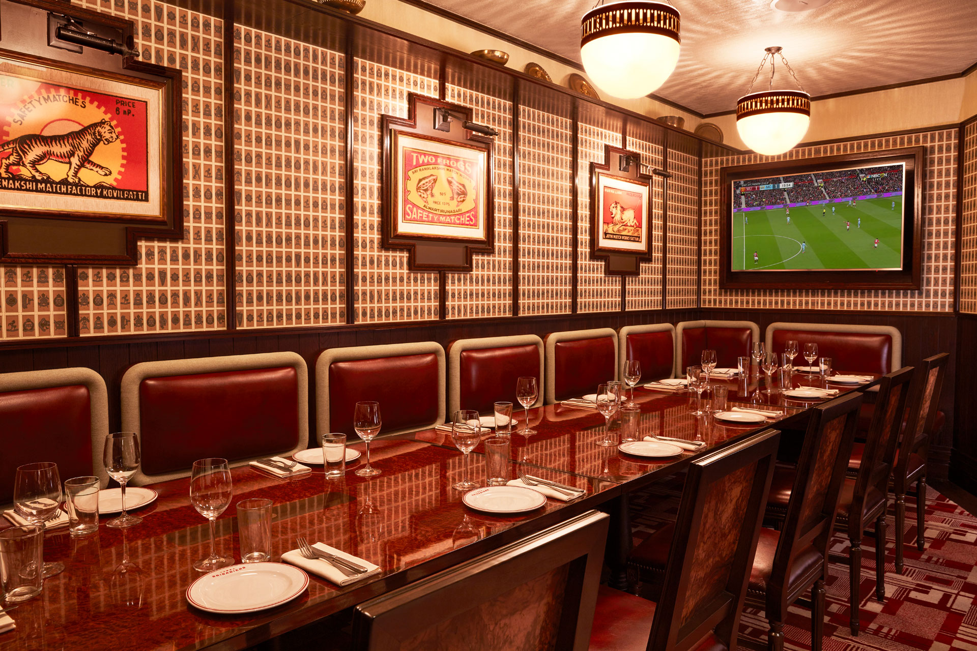 TV screen showing football at Brigadiers