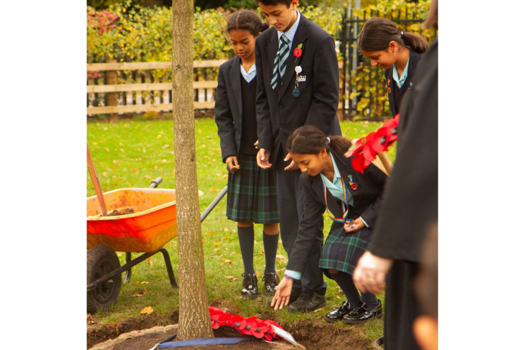 Wreaths are laid on the ground