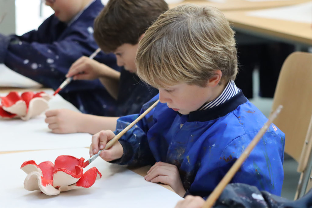 Pupils painting the poppies