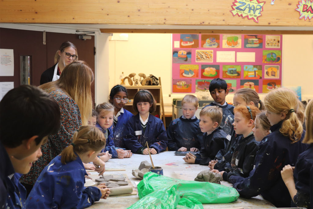 Year 4 pupils moulding the clay poppies