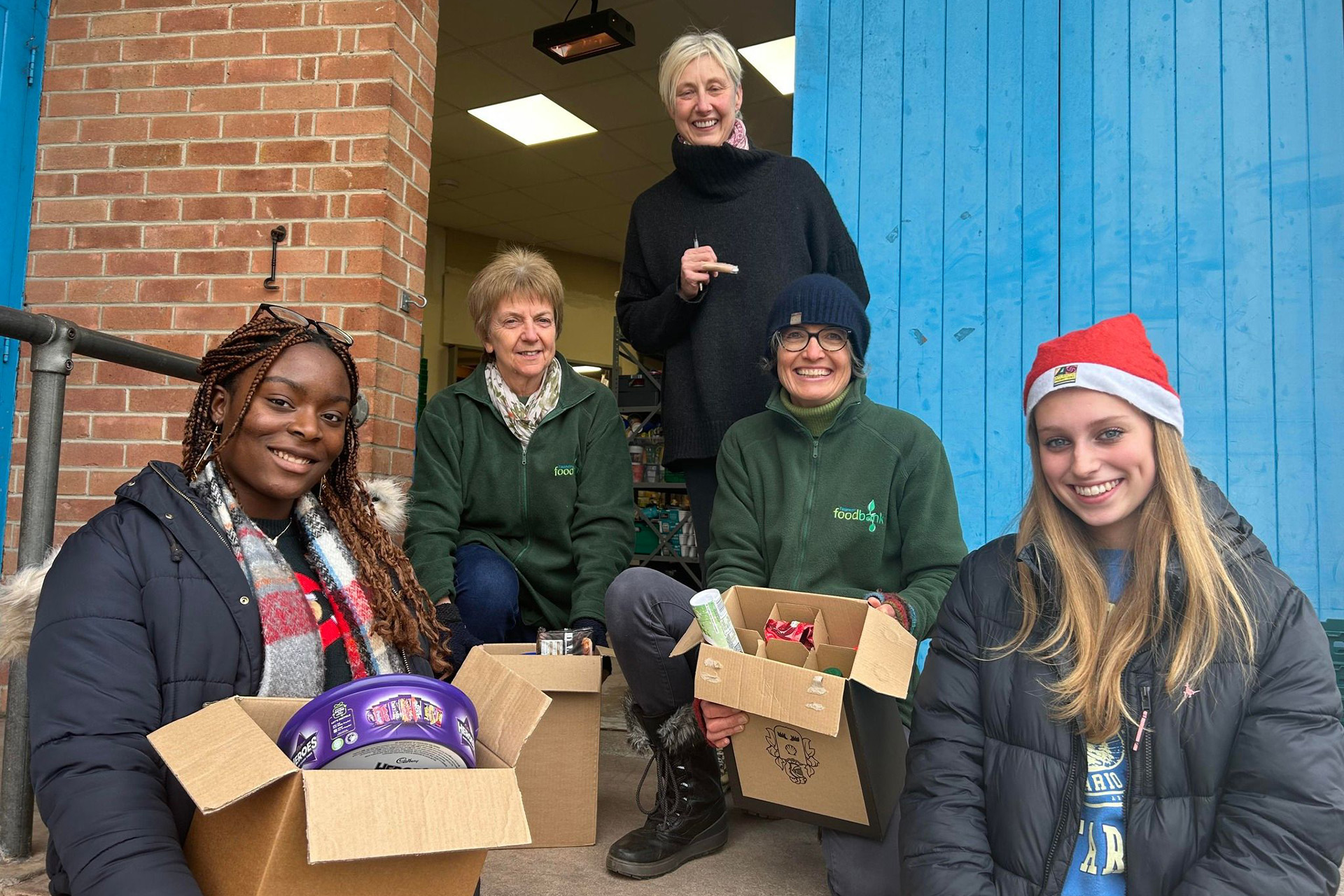 Queen's College Deliver Christmas Treats to Local Foodbank