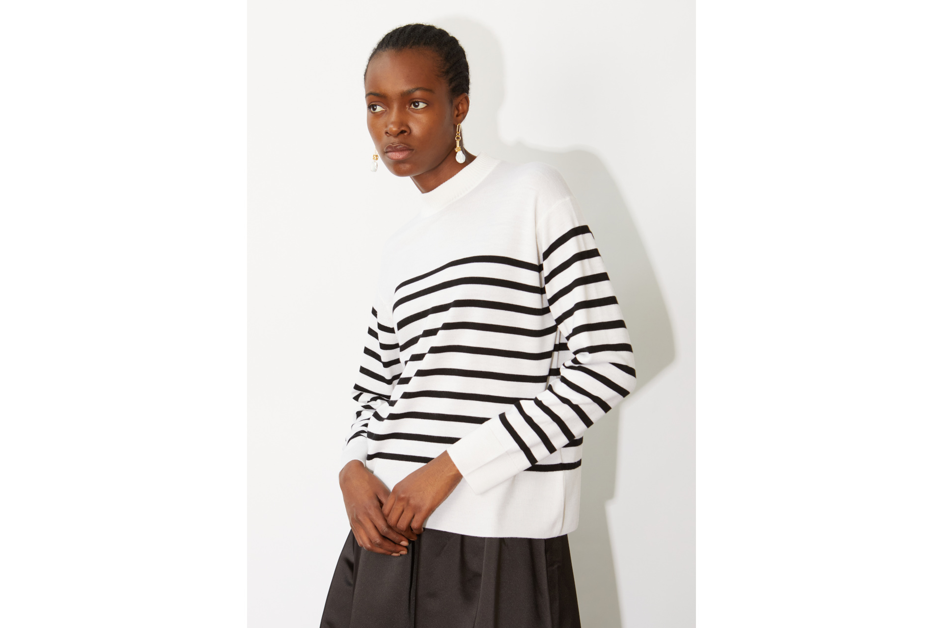 Woman in white Breton stripe jumper