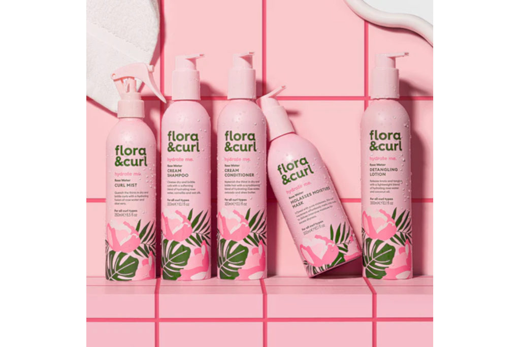 Pink bottles in front of pink tile background