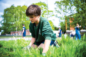 Shrewsbury School pupil gardening