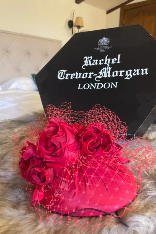 Pink hat next to black box