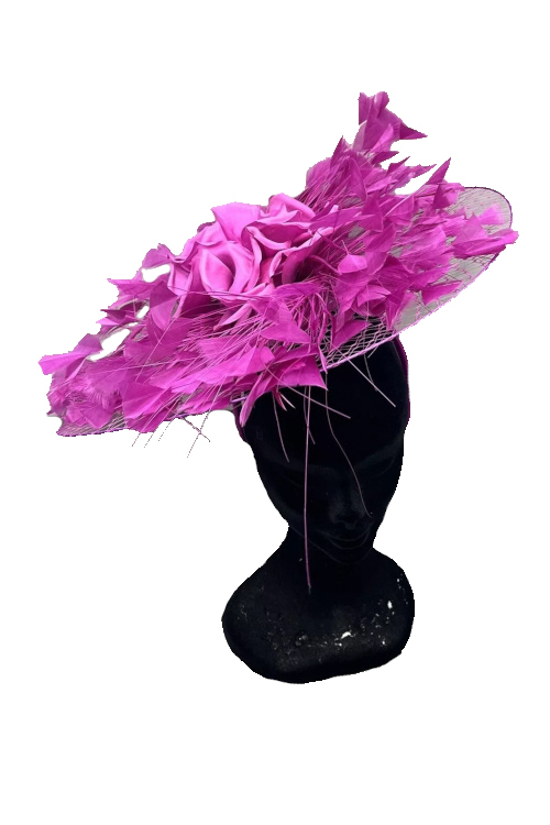 Mannequin wearing pink fascinator