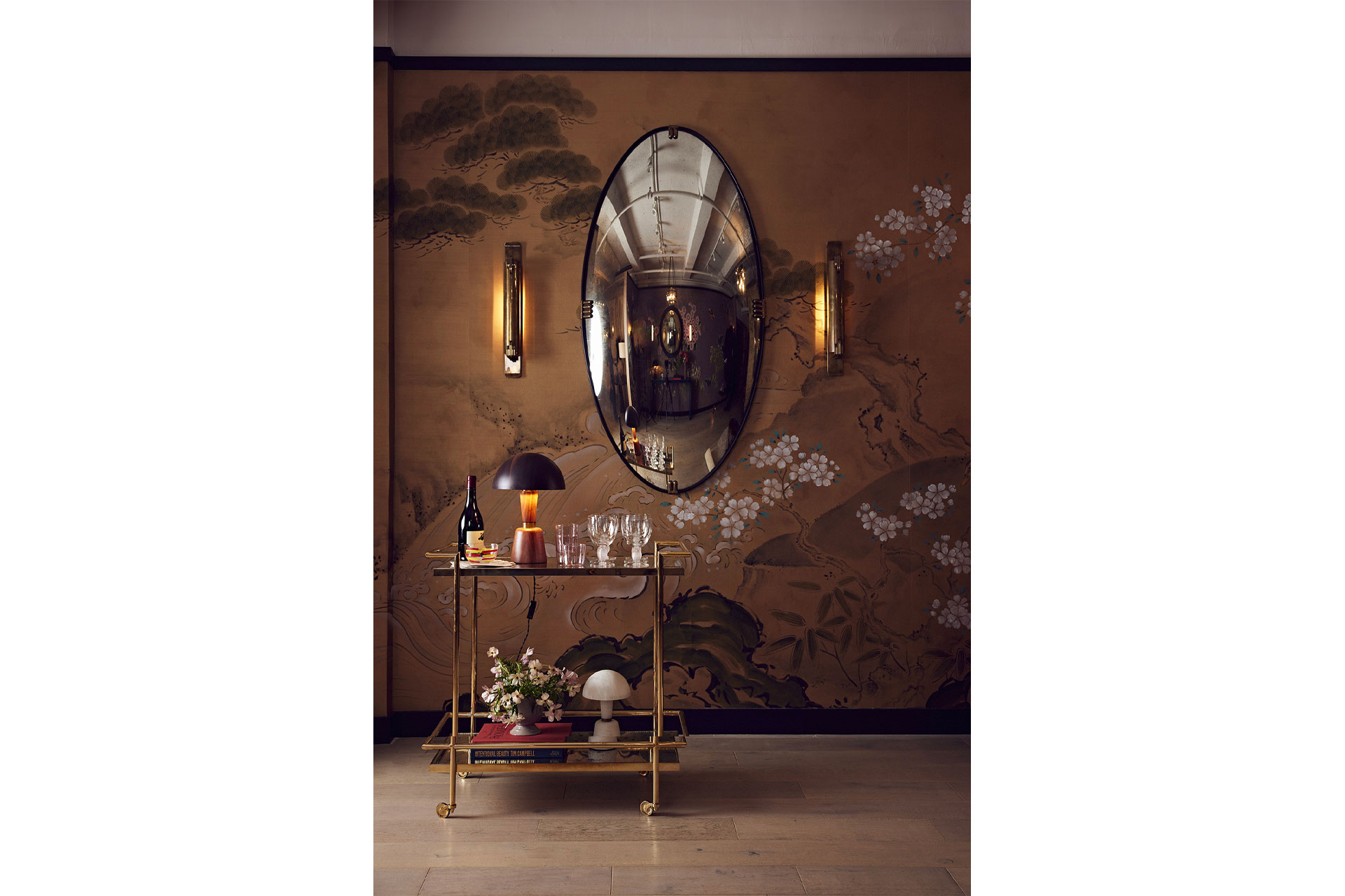 Fromental wallcovering with bar cart and mirror