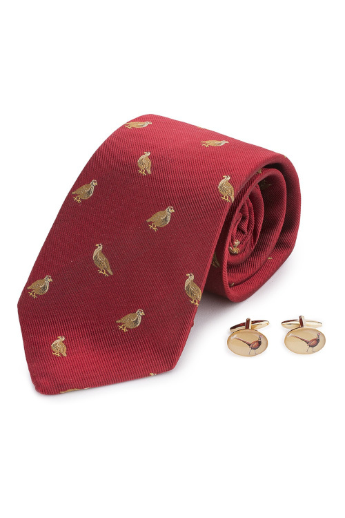 Red tie and gold cufflinks