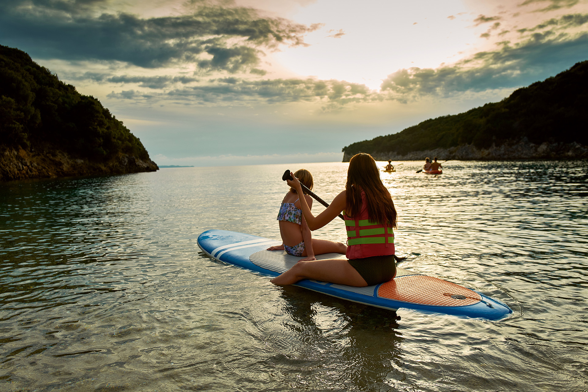 Teenagers on paddleboards